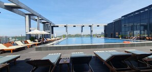 Outdoor pool, open 9:00 AM to 9:00 PM, sun loungers