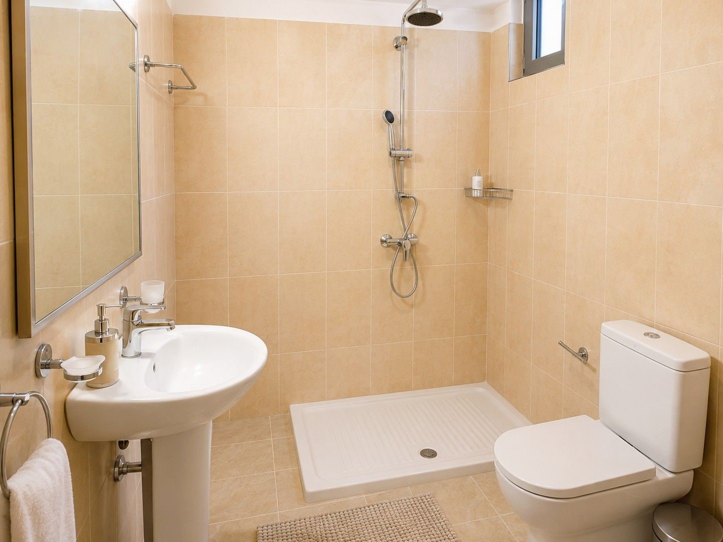 A bathroom with a white sink, toilet, and shower.