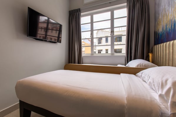Desk, blackout curtains, free WiFi, bed sheets