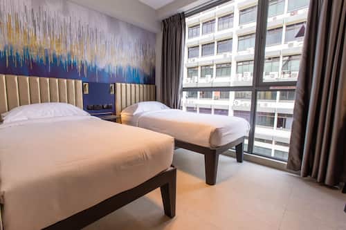 Deluxe Room, 2 Twin Beds | In-room safe, desk, blackout drapes, iron/ironing board