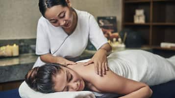 Experience a soothing massage therapy session in a serene spa setting, complete with a skilled therapist and a tranquil ambiance.