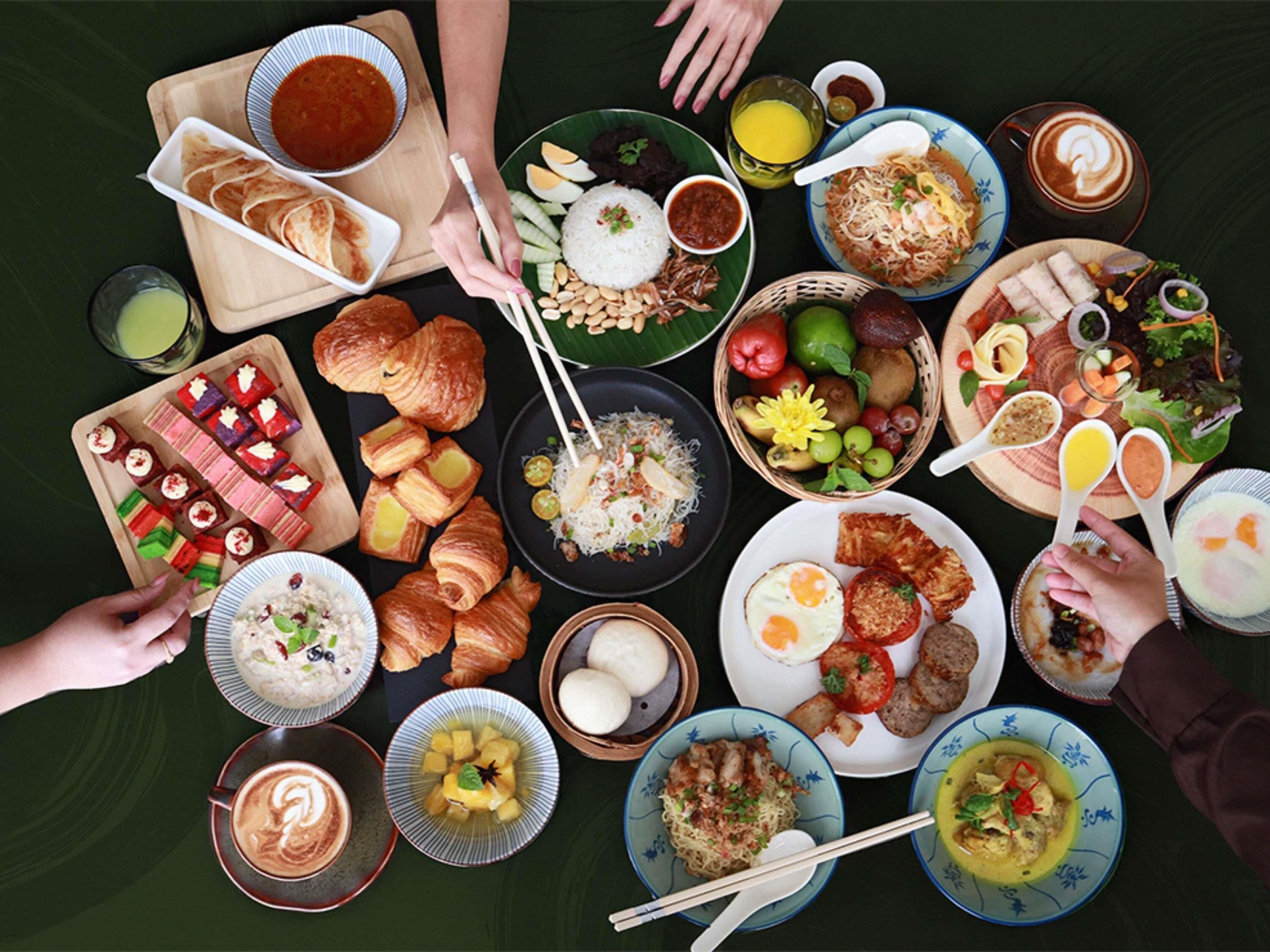 A variety of dishes and food items arranged on a table, suggesting a meal setting.