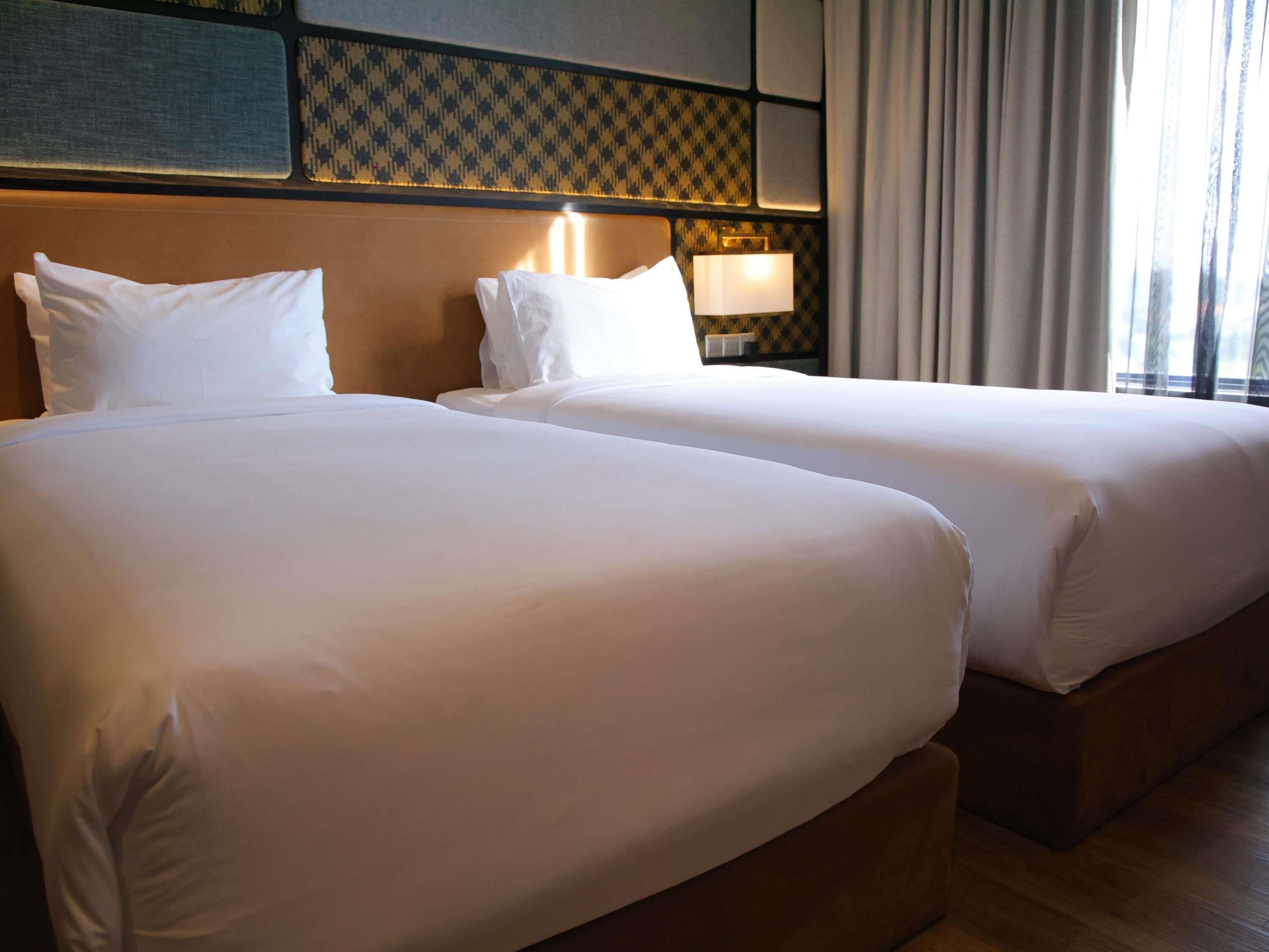 Chambre Deluxe avec lits jumeaux, 2 lits jumeaux | Coffre-fort pour ordinateur portable, rideaux d’obscurcissement