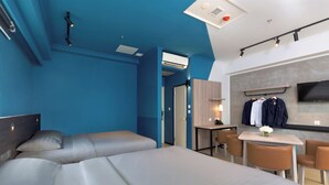 A modern hotel room with a large bed, a desk, and a TV. - Ibis Budget Phnom Penh Riverside (Phnom Penh)