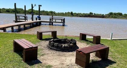 House on intercoastal with lighted fishing pier