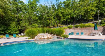 Comfortable home steps from lake with fireplace & covered deck