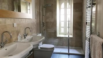 Shower, hair dryer, towels, toilet paper