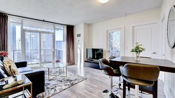 City Apartment | Living area | 40-inch Smart TV with cable channels, TV
