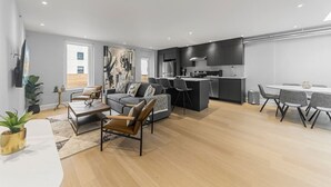 A modern apartment with a living room, dining area, and kitchen. - Stunning 2 beds, 2 baths, AAA location, rooftop (Montréal)