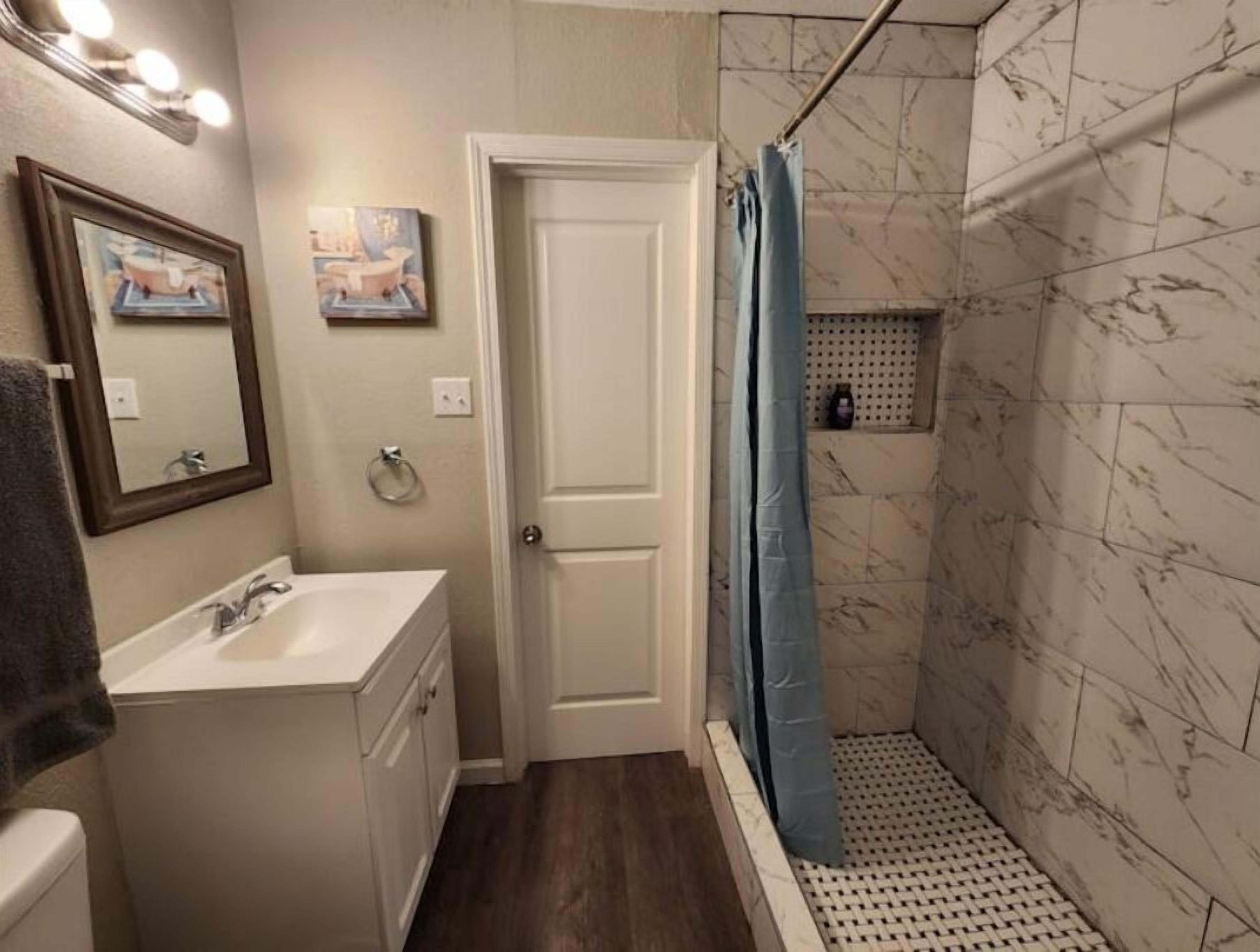 Shower, towels, soap, toilet paper