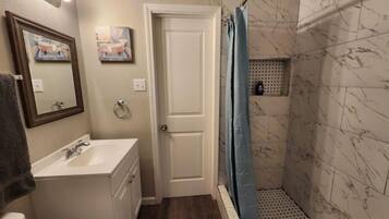 Shower, towels, soap, toilet paper