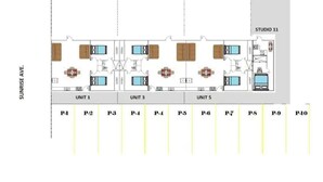 Plano de planta de un edificio con tres unidades, cada una con dormitorios, baños y una sala de estar. A la derecha, un estudio identificado como 'STUDIO 11'.