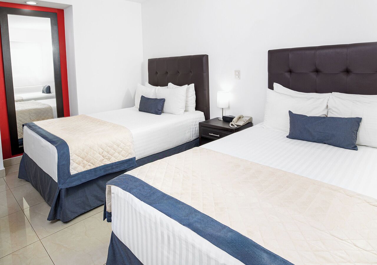 Standard Double Room, 2 Double Beds | In-room safe, desk, laptop workspace, blackout drapes