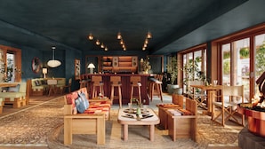A cozy interior with a bar area, seating, and a fireplace. - Oyster Estate (Greenport)