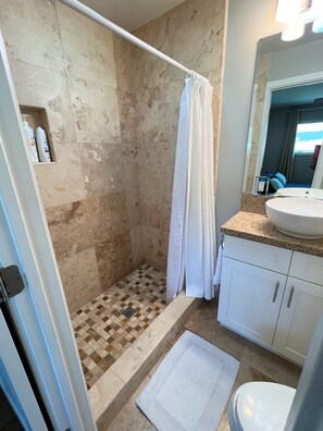 Shower, hair dryer, towels, soap