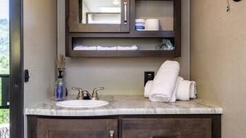 Shower, hair dryer, towels, soap