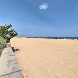 On the beach, sun loungers, beach towels