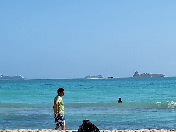 On the beach, sun loungers, beach towels