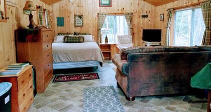 White Mountain scenic river camp with cozy cabin & comfy RV