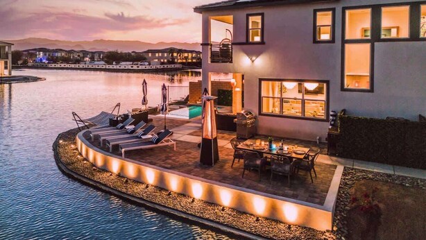 A modern house with a pool, outdoor seating, and a patio area. - 4 Private EnSuites, 270* Lake View, pool+spa, Sleeps 12 (Indio)