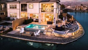 A two-story house with a swimming pool, outdoor seating, and a view of mountains. - 4 Private EnSuites, 270* Lake View, pool+spa, Sleeps 12 (Indio)
