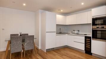 Apartment, 2 Queen Beds | Private kitchen | Fridge, microwave, oven, stovetop