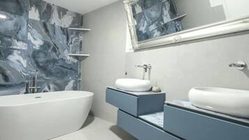 Shower, deep-soaking bathtub, hair dryer, towels