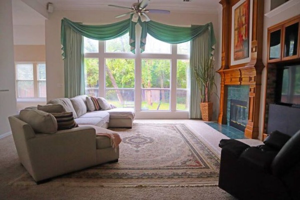 Smart TV, fireplace, books, printers