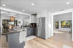 Enjoy cooking in this well-equipped kitchen with a stove, ample counter space, and a refrigerator.
