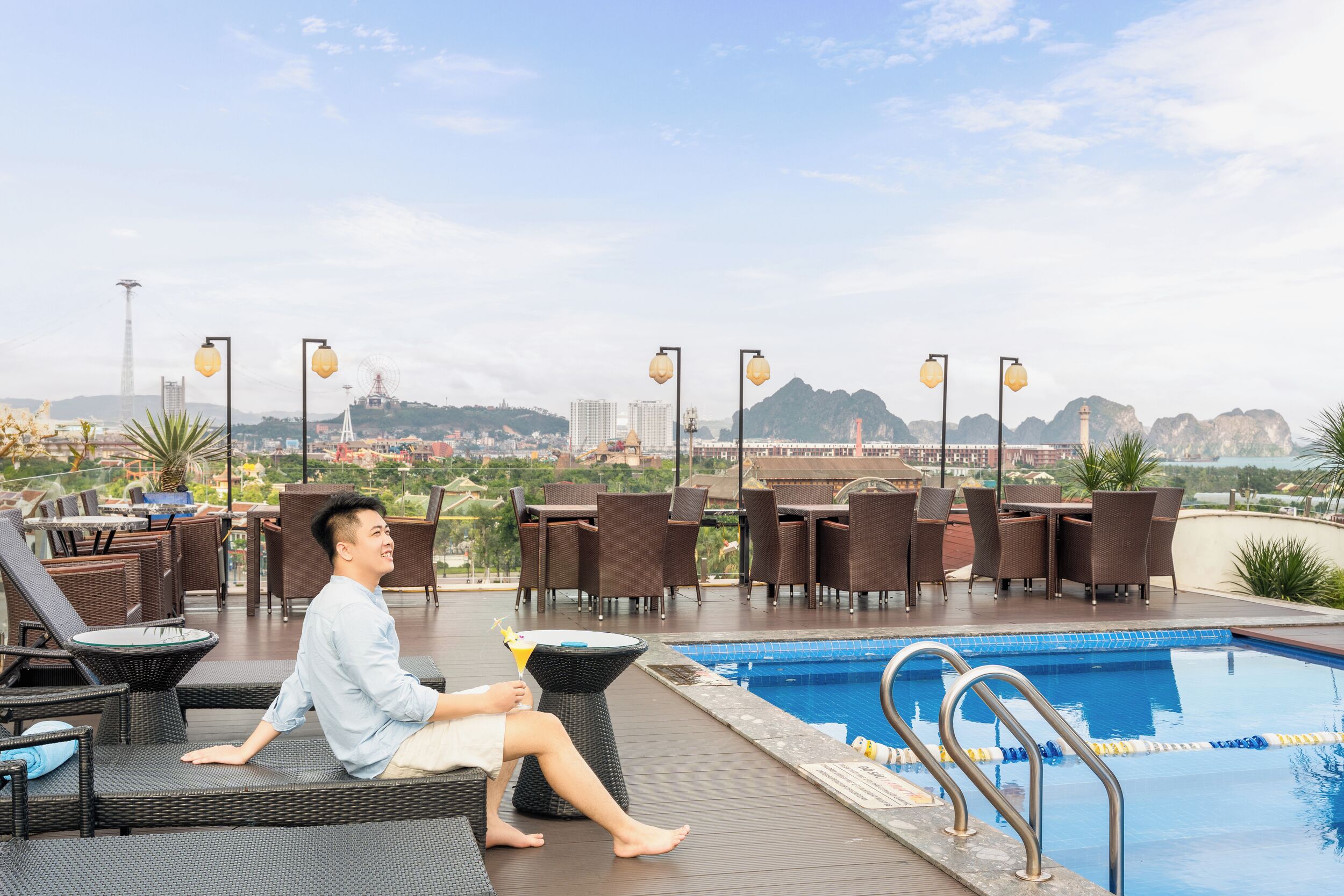 A poolside area with lounge chairs and a swimming pool.