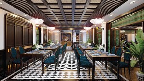 A formal dining area with a checkered floor, long tables, and chairs. - Grand Fleuve Boutique  (Bai Chay)