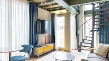 Superior Duplex, 1 Bedroom | Living area | 50-inch LED TV with cable channels, TV, heated floors