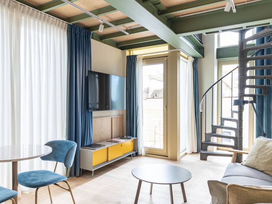 Superior Duplex, 1 Bedroom | Living area | 50-inch LED TV with cable channels, TV, heated floors