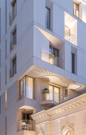 A multi-story building with balconies, large windows, and a grand entrance with decorative elements. - Rosetti Hotel (Bucharest)