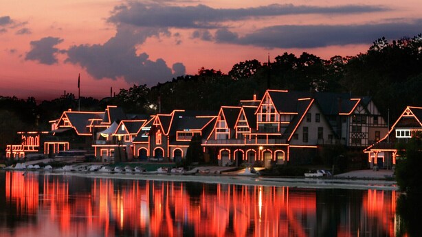 A waterfront property with illuminated architectural structures reflecting on the water. - Fairmount Neighborhood Gem! (Philadelphia)