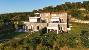 A two-story stone house with a balcony, outdoor seating, and a garden. - #1 Cinque Terre, Tuscany, Liguria, Lerici (Liguria)
