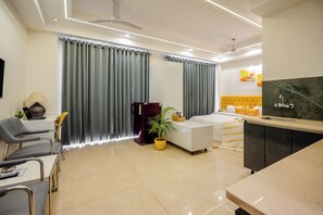 Premium bedding, desk, laptop workspace, iron/ironing board