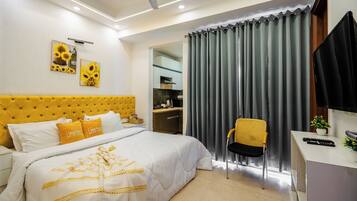 Premium bedding, desk, laptop workspace, iron/ironing board