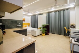 Premium bedding, desk, laptop workspace, iron/ironing board