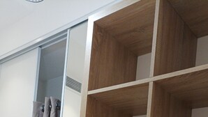 A room with a sliding door, a wooden desk with a map, and a bookshelf. - 3min walk BEACHES, PARKING Town Hall, Pedestrian street Quiet 42 m2 CLIM 3p max (Menton)