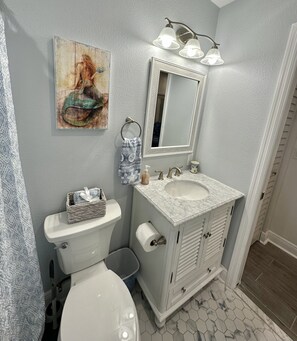 Shower, hair dryer, towels, soap