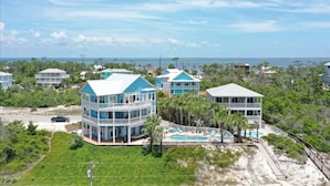 A coastal property with multiple buildings, a swimming pool, and a view of the ocean. - Sea Grass Neighborhood * Private Pool 5 Bdrms (Cape San Blas)