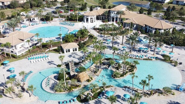 A resort with multiple swimming pools, palm trees, and lounge areas. - Cinema Paradise: Last Minute Deal Private Pool/Spa (Davenport)