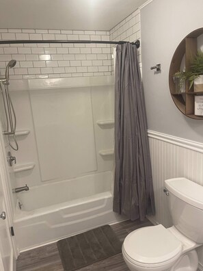 Bathtub, hair dryer, towels