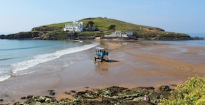 A beach with a dune, a beach buggy, and buildings on the hill. - Badgers Den, Bantham South Devon (Bantham)