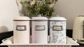 Three kitchen storage containers labeled tea, sugar, and coffee on a tray. - Dreamwood Woodland Retreat with Private Hot Tub (Blandford Forum)