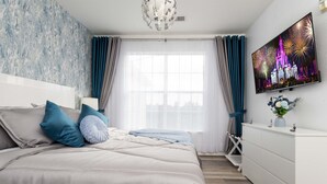 A bedroom with a bed, a dresser, a TV, and a window with curtains. - 2BR Nemo Condo near Disney | Gated with Pool (Kissimmee)