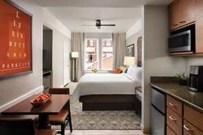 Relax in this stylish room with a large bed, kitchenette, and city view.