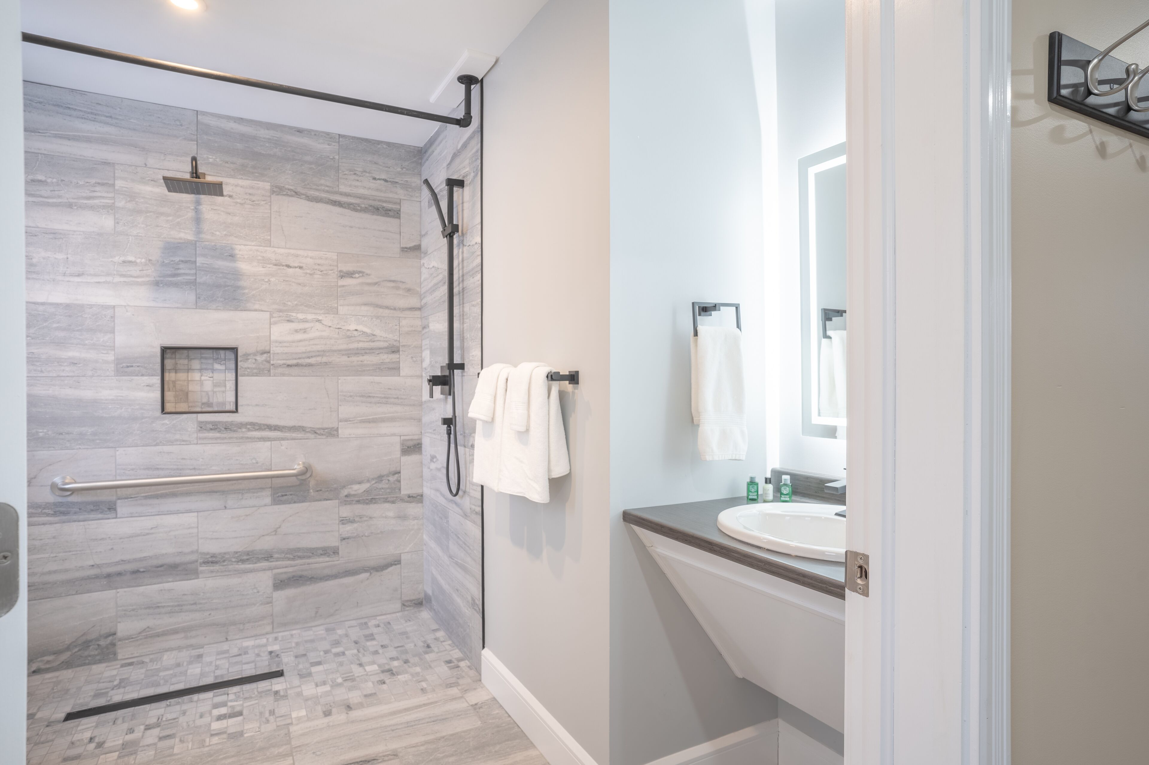 Shower, hair dryer, towels, soap