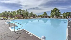 A swimming pool with metal railings and a tiled deck. - Family-Friendly Branson Condo w/ Outdoor Pool! (Branson)